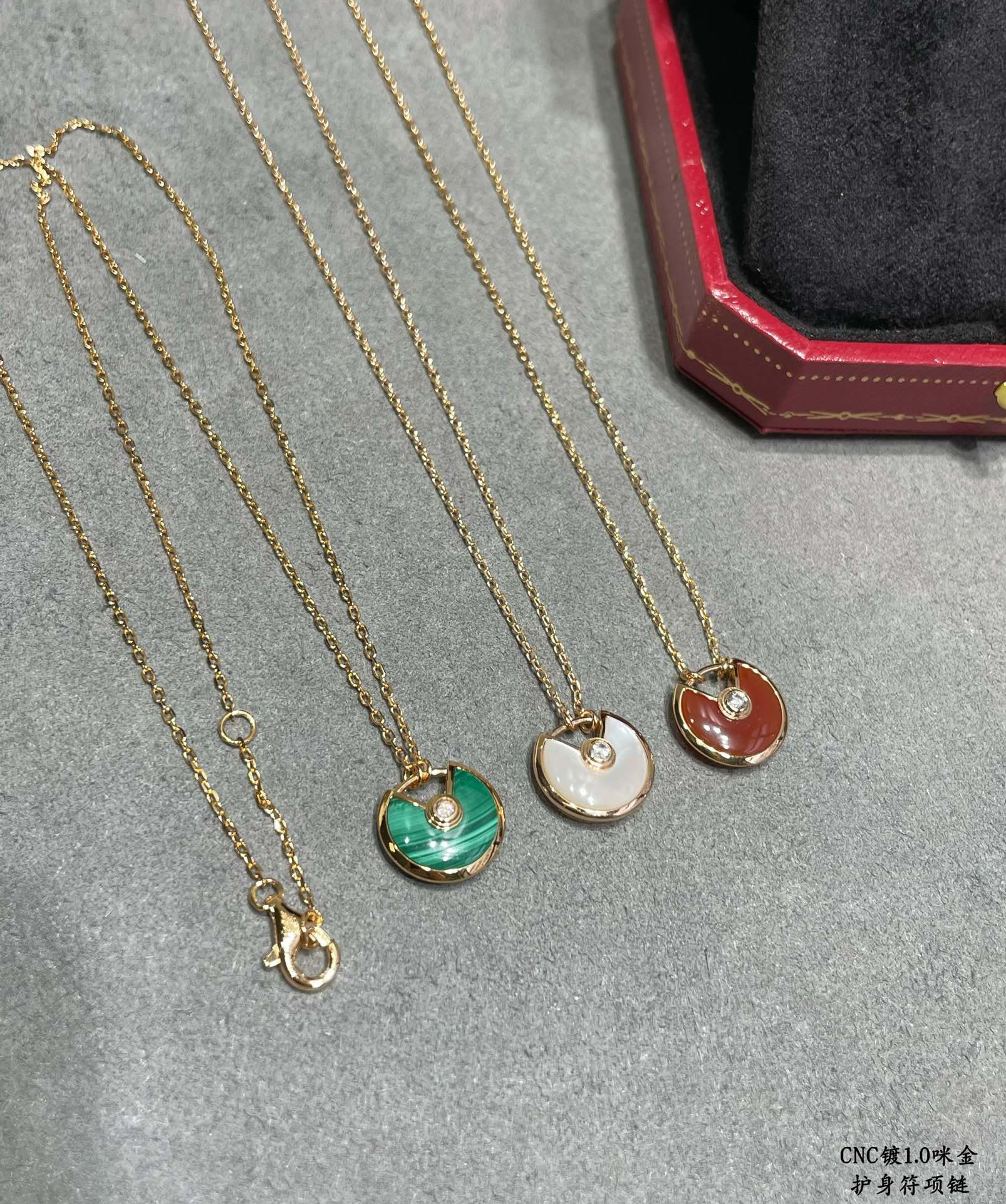 Ca*t*er amulet necklace