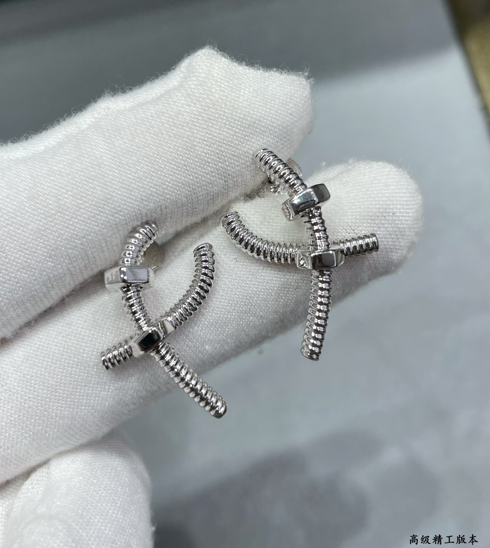 Ca*t*er cross screw earrings