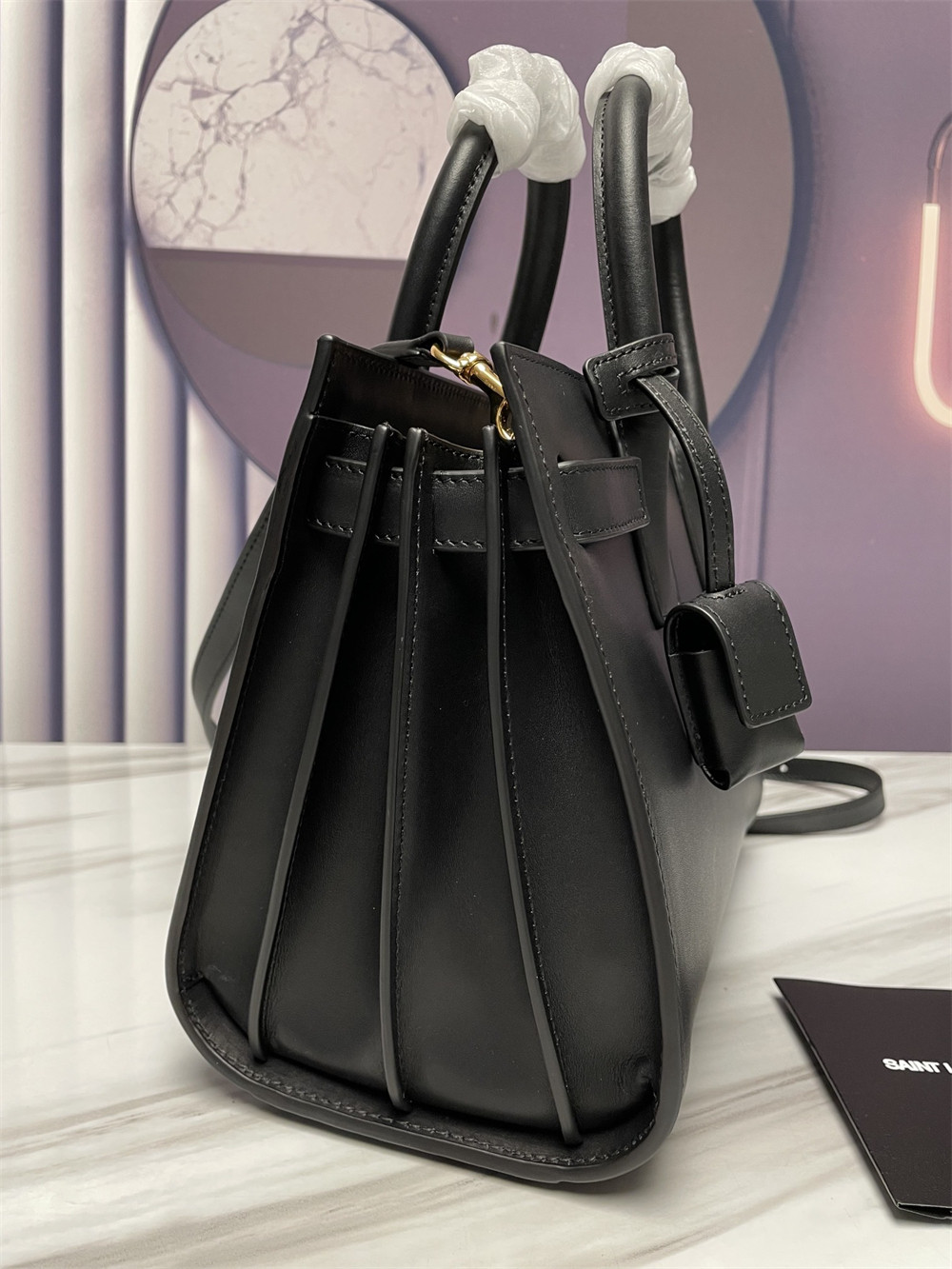 Y*L sac de jour baby in shiny leather black