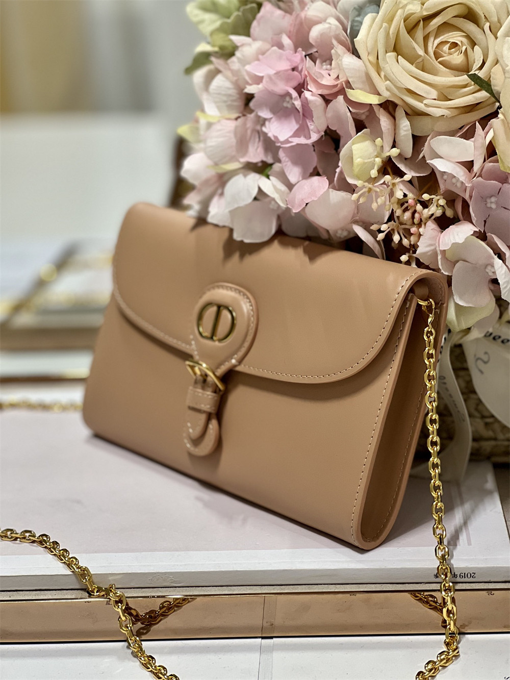 D*or bobby east-west pouch with chain latte smooth calfskin amber