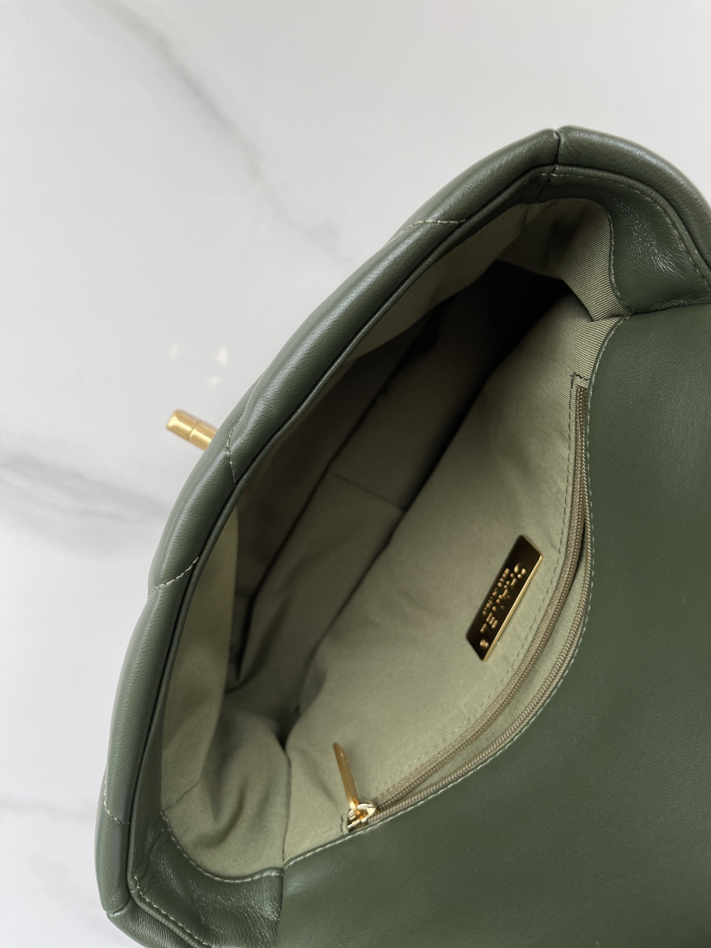 Ch*el 19 handbag shiny leather, gold-tone, silver-tone & ruthenium-finish metal dark green 6.2 × 10.1 × 3.5 in