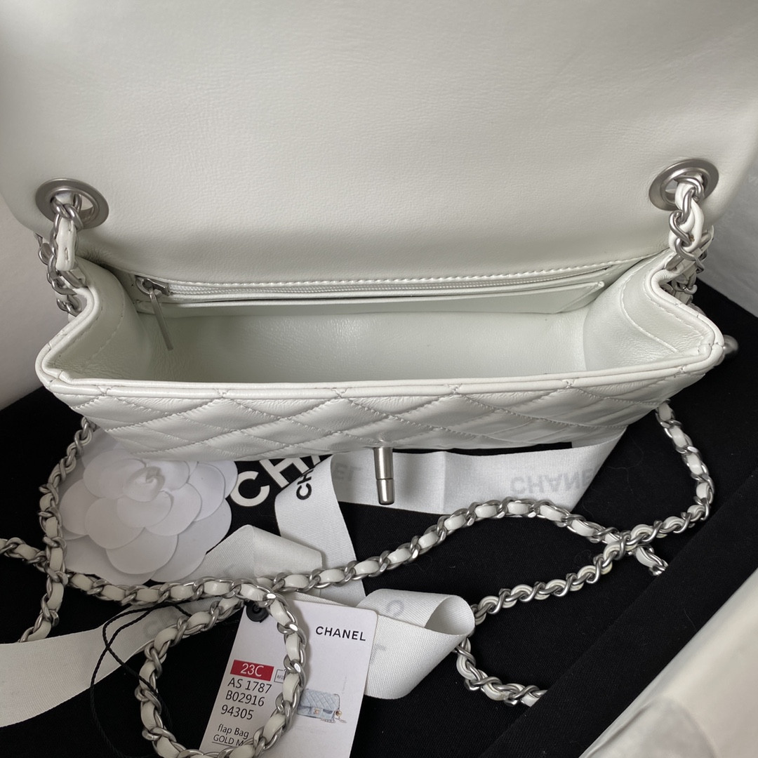 Ch*el mini flap bag shiny calfskin & silver-tone metal white 4.7 × 7.8 × 2.3 in