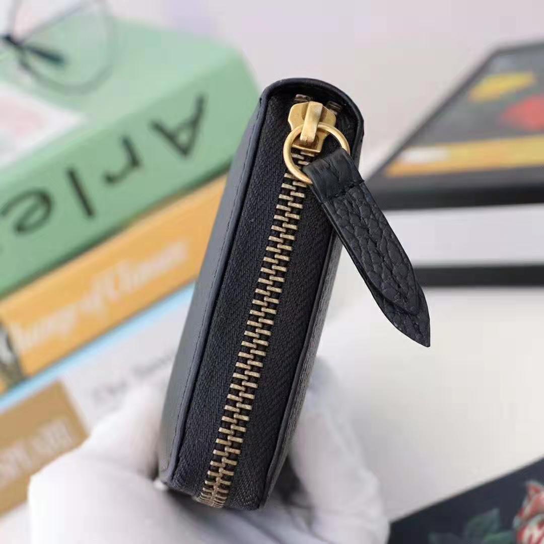 G*u*i gg unisex leather zip around wallet in black leather