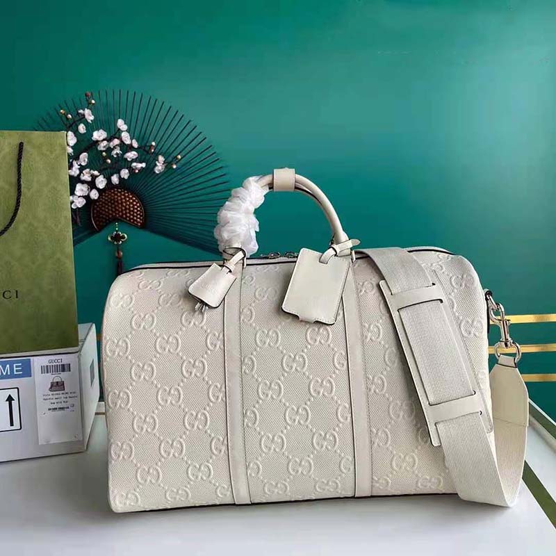 G*u*i gg unisex gg embossed duffle bag white gg embossed leather
