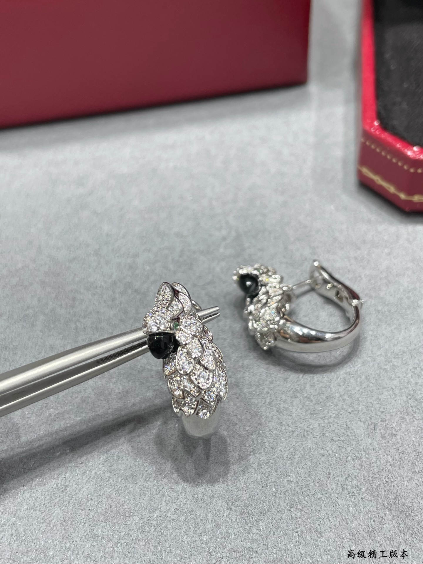 Ca*t1er Parrot Earrings