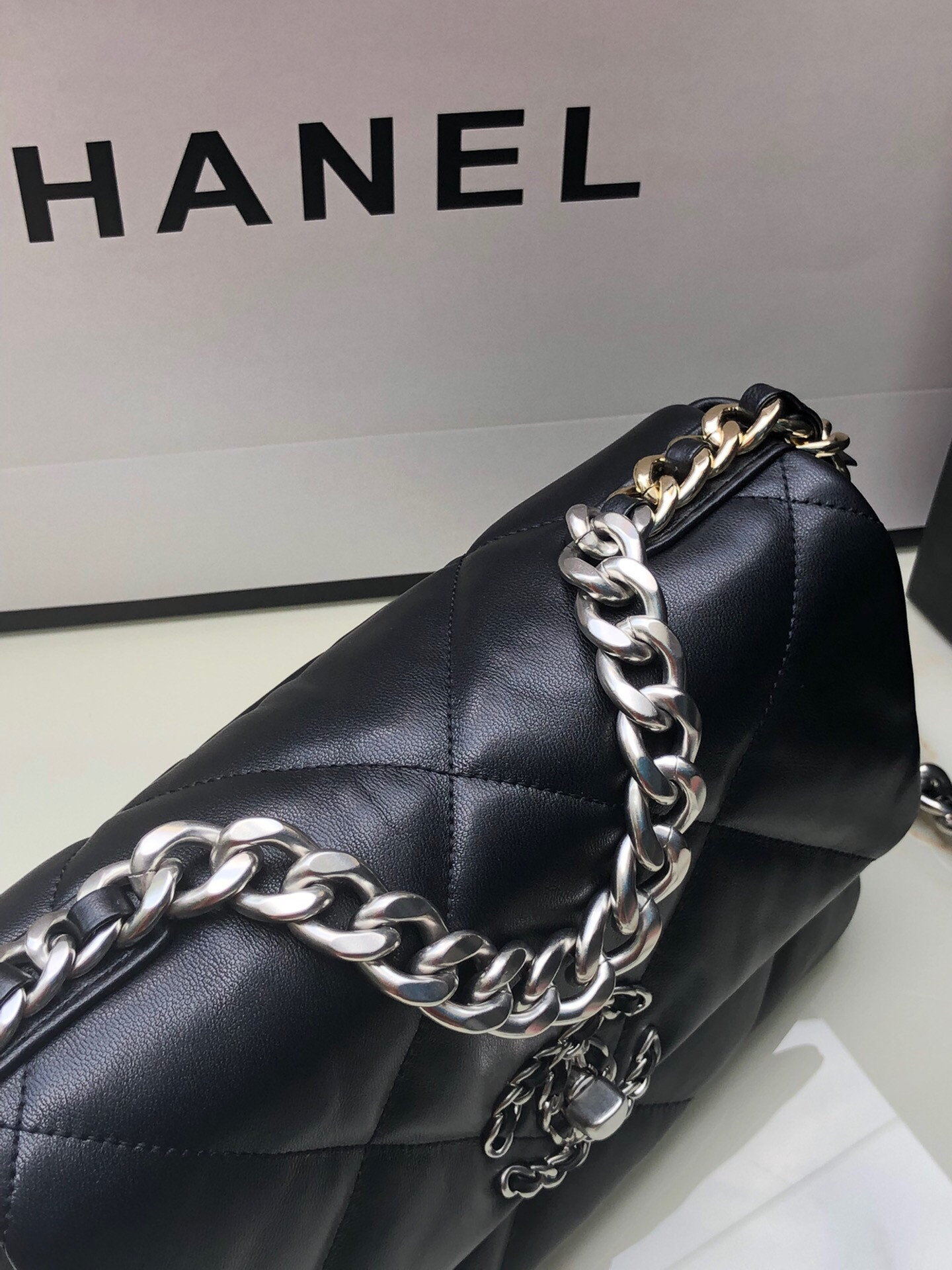 Ch**el 19 HANDBAG Shiny Leather, Gold-Tone, Silver-Tone & Ruthenium-Finish Metal Black 6.2 × 10.1 × 3.5 in