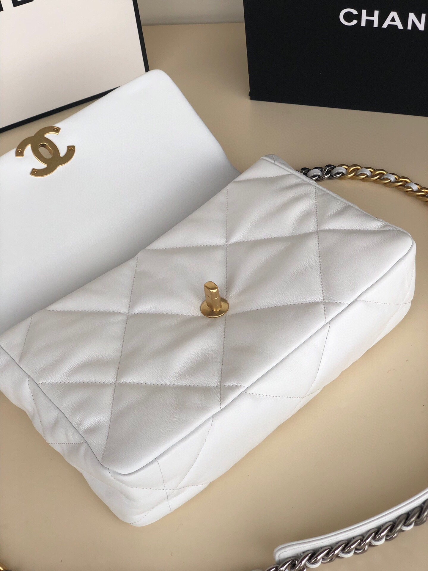 Ch**el 19 LARGE HANDBAG Shiny Leather, Gold-Tone, Silver-Tone & Ruthenium-Finish Metal White 7.8 × 11.7 × 3.9 in